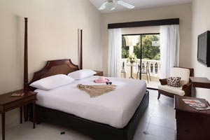 Junior Suites with ocean, pool, or garden views at Cofresi Palm Beach Resort & Spa
